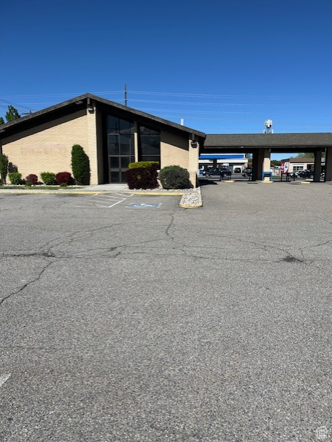 View of property with parking