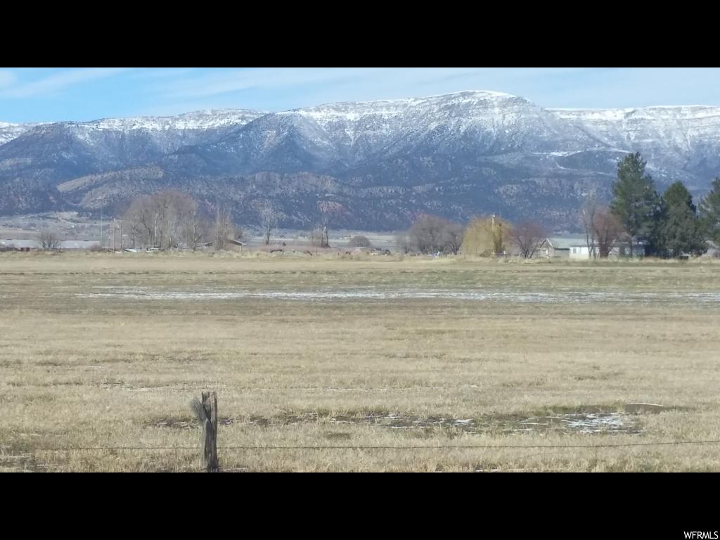 13700 4000 E N Chester, UT This is an amazing price for this land. This 32+ acre parcel is located just South past the SW corner of the Chester crossroads. Natural gas and power run in the road. 1062 feet frontage on Hwy 132. It also fronts on County Road 117. Zoned both agricultural and commercial. Flood irrigated. 20 shares Moroni Irrigation. Two tax IDs: 25907 and 25935X. MAP IS CORRECT!