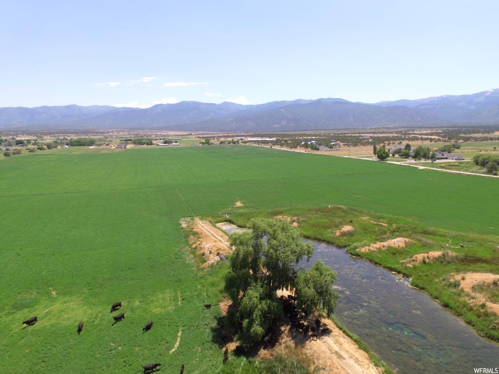 Spring City, UT 173 of the 185 acres are irrigated. Spring and storage pond provide water for 140 acres, with the balance being irrigated with Horseshoe irrigation rights. The setting is spectacular in the quaint community of Spring City. The irrigation is pressurized. The property front Spring City's 1100 West where there are water and power lines. Price has been reduced twice. Will look at your offers.