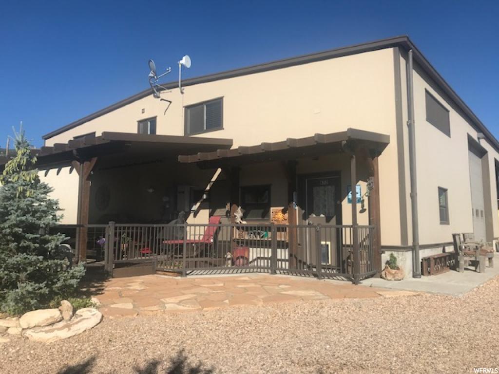 12370 JUNIPER DR E B-52 Fairview, UT Incredible Shop and Home. Living area is 1140 sq.ft. 1 Bed, 2 Baths, Living rm, Kitchen, Dining area, Wood stove, Heat & Air Conditioning, Water Softner, Washer & Dryer, 420 sq.ft outdoor covered trex deck with Roller Shades. Fully landscaped, fenced yard, Private yard with trees surrounding. Shop 60 X 120 with all insulated panels. Heated - 2 propane heaters, Log stove and pellet stove. Divider for living area, garage space and storage. Mezzanine 400 sq.ft. All sides wired and plumbed for Air - Ingersol Rand Air Compressor. Detached gas station and storage. 600 Gallons of Diesel, 600 Gallons of Gas. 40' Connex for Firewood, pellet storage etc. Fire pit area & spot for camp trailer/RV Area. Additional area for parking.
