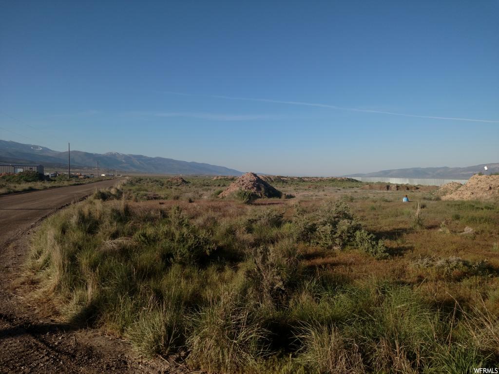Chester, Utah INDUSTRIAL LOT W/ County Rd frontage. Located along the South side of 13000 N Comes with underground water rights. Well already drilled. 2nd well on the parcel belongs to Lot #5 Plat B.
