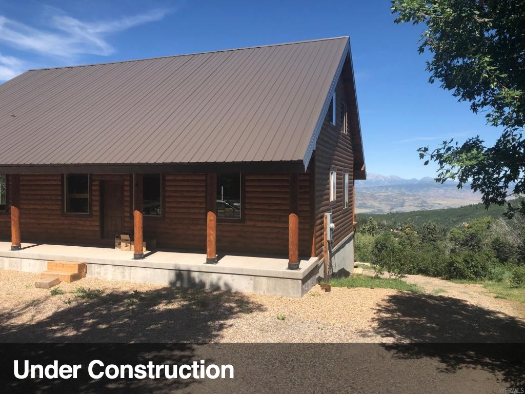 14825 THADS PEAK DR E J-65 Fairview, Utah Private! Forested! Peaceful! Gated Community. This is one of the very best view lots!. Sold "AS IS" only $84/sq ft! With 4,384 sq it's a deal at Gates going in & out of the property, Garage for the snowmobile, vehicle. Power, and septic, & water holding system are in. Check this out! You will see high quality everywhere! Hydronic radiant heat etc. Close to 4-way. Winter Fun! Snowmobile into the property in Winter. You don't have to go far away to get away! Available opportunity for Buyers to negotiate an additional price with the owner builder to finish this cabin to their own specifications, colors etc. or finish yourself or with your own builder.Call for more information Buyer and Buyers agent to verify sq.ft. and ALL information.