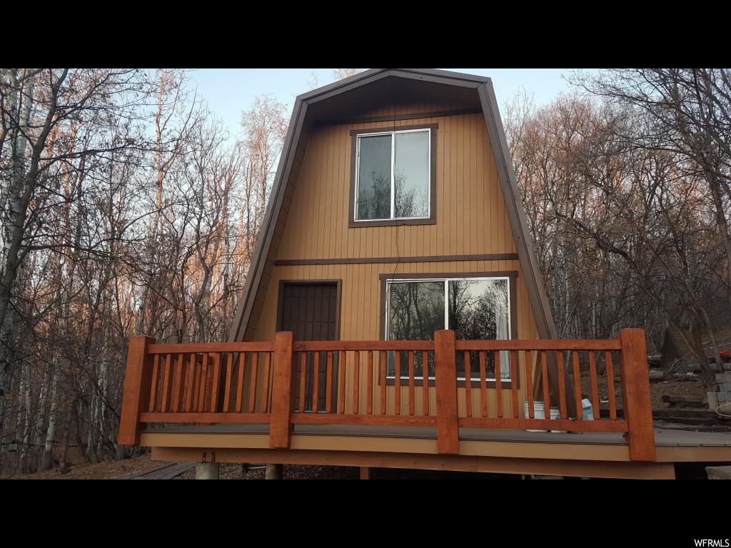 1074 EDGEWOOD DR N E Fairview, UT Cabin in Aspen Hills gated resort surrounded by Aspen & Maple trees. The main floor has a living area, kitchen and bathroom then 2 bedrooms up. The cabin is on a beautiful .70 acre lot and comes with an additional .60 acre lot to make 1.30 acres total. The extra lot is a nice open space buffer but could be sold or built on in the future. It comes with a new metal roof and new Trex deck. No grid utilities; has propane, comes with a generator, has a septic tank and has a large newer cement underground water storage tank. You can haul your own water or hire it done once a year for a minimal cost. Access is seasonal, high enough to need snowmobiles in the winter but cool in the summer, about 7,750' elevation. Miles of hiking or riding trails right from the doorstep; horses, side-by-sides and 4-wheelers are welcome. Lots numbers 1074 & 1075 and Tax ID's 35168 & 35169