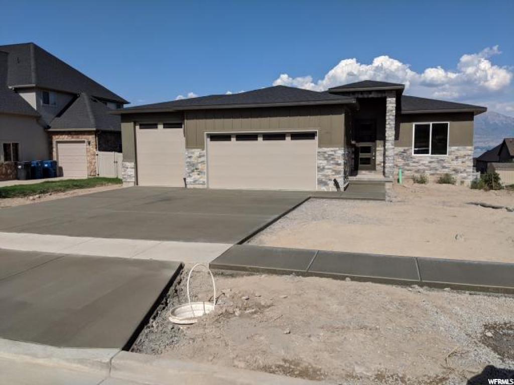 3898 S BEACON DR Saratoga Springs, Utah REDUCED PRICE !! Don't miss out on the beautiful brand new home. This home features custom 2 tone paint, granite counter tops, stainless steel appliances, shaker style maple cabinets, gas fireplace, separate soaker tub and shower in the master bath. There is also a power vented water heater and a 26 deep garage. Square footage figures are provided as a courtesy estimate only and were obtained from plans. Buyer is advised to obtain an independent measurement.