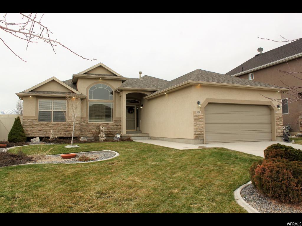 1783 N GOLDENROD WAY Saratoga Springs, Utah Terrific Rambler in wonderful area of Saratoga Springs. Just minutes to Redwood Road, I-15, Pioneer Crossing, shopping, entertainment, restaurants and MORE! This community is in the PERFECT location! This 3 bedroom, 3 1/2 bathroom home features a wonderful kitchen and great room area that opens onto the SPACIOUS covered deck in the fenced backyard! You'll love the roomy master suite with walk-in closet, separate jetted tub and shower plus dual vanity sinks! There is plenty of room to expand in the unfinished basement too!