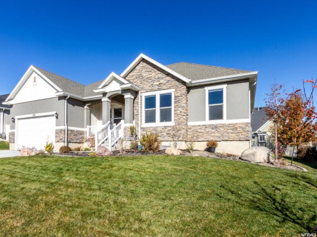 876 W MOUNTAIN PEAK DR Saratoga Springs, Utah This stylish, one owner home is a must see! Located in the beautiful Saratoga Springs neighborhood of Talus Ridge. The upgraded kitchen offers Quartz countertops, stainless steel appliances, a combination of white and gray cabinetry, pull out drawers, and a walk in pantry. Kitchen opens into a vaulted great room with a sliding door to your fenced in backyard. The spacious master suite includes a separate tub and shower and walk in closet. The family room/game room in the basement is newly finished with carpet you could sleep on and enough room to let little ones play while you enjoy your open air theater room. And if all of that is not enough, consider what this neighborhood offers. Central location to elementary, middle and high schools and close proximity to Neptune park, shopping, and easy access to Pioneer crossing. Home is fully landscaped with sprinkler system and trampoline. Such a plus considering how much it costs to put a yard in. Don't hesitate call now and see this home for yourself!