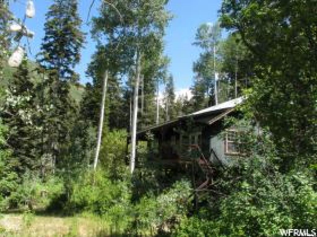 1041 NORTH FORK RD S E 1041 Fairview, Utah Mountain cabin on 3.4 acres in the Manti La Sal Mountains in Northern Sanpete County. Property consists of 5 Lots in Aspen Hills being Lots 1020, 1021, 1040, 1041 & 1042. Property is located high in the mountains in a beautiful setting with large Pine and Aspen trees. A year round stream is just off the property in the valley below. Cabin has a large 300 sq ft covered deck in front that provides a beautiful view of the valley. This is a gated community - contact listing agent to borrow a key or for a showing of the property. GPS Coordinates: 39°34'30.9"N 111°21'16.7"W. Elevation 7,851