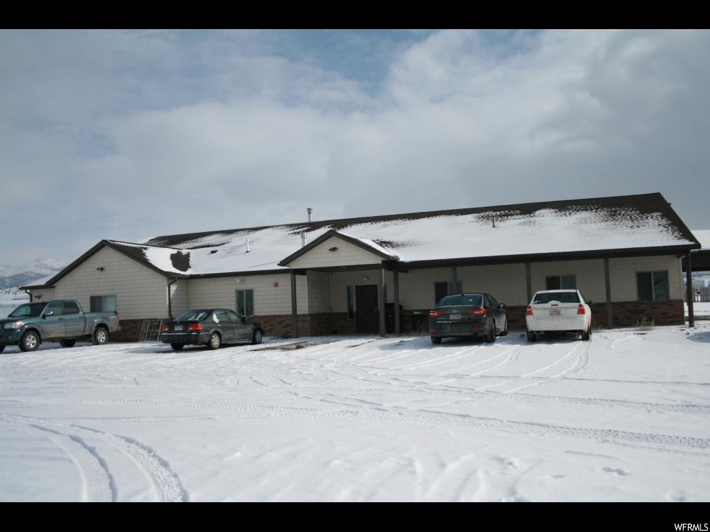 1450 21260 N E Moroni, UT This property was built and is currently being used for a residential therapy treatment home. It is set up as a home environment with a large kitchen, family area but bathrooms are more of a public restroom setting. One room is set up as a theater room, there are also offices that could be converted to bedrooms, etc. Home is heated with forced air gas furnace and a hot water boiler system. A large workshop/garage (1950 sq. feet) along with a 900 sq.ft. apartment attached to the workshop/garage are included with this property. This square footage is not included with the main home. The apartment has 1 bedroom, 1 bath, kitchen, family room, laundry and pantry. The workshop may be a potential business opportunity as well. This property could potentially be used for either business or residential. Buyer and buyer's agent to verify information and check regulations for a possible business venture.