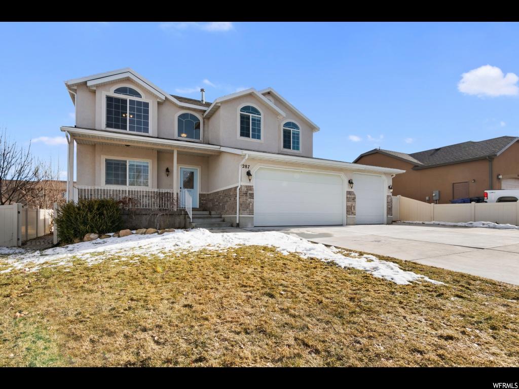 287 W HILLSIDE DR Saratoga Springs, Utah Stunning 5 bedroom home in the desirable Benches neighborhood with panoramic mountain and lake views. Open main floor and kitchen. Brand new carpet and paint. Fully finished basement with huge great room. Cold storage room. Fully landscaped yard, trees, fenced yard, and deck. 4 car garage. RV parking. Immediate access to trails & mountains. The neighborhood is amazing, including 2 nearby parks, an elementary school, and new middle school and new.. Easy to show. Square footage figures are provided as a courtesy estimate only. Buyer is advised to obtain an independent measurement.