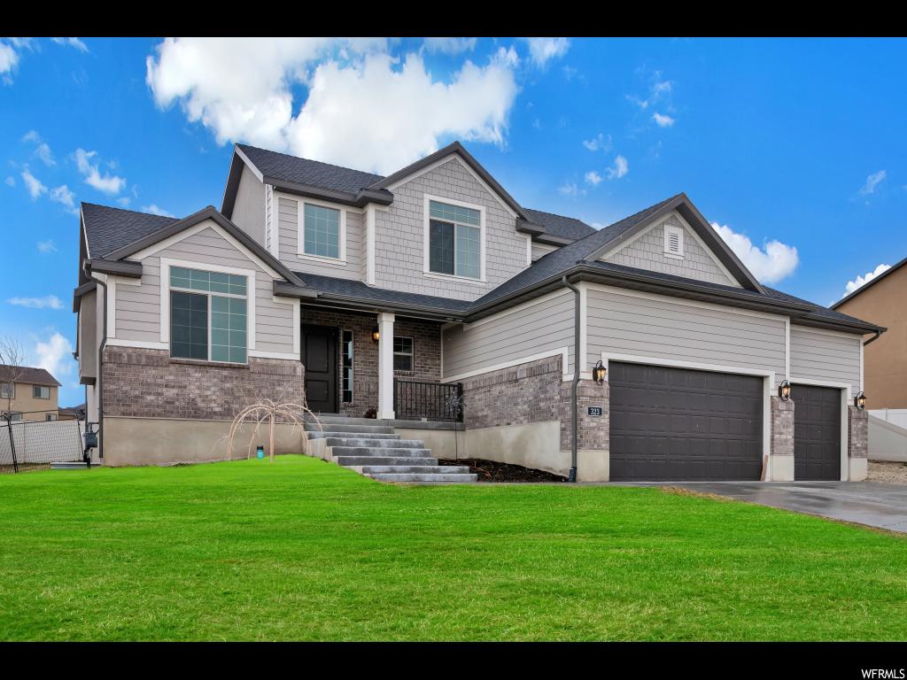 323 W SHADOW RIDGE DR. S Saratoga Springs, Utah Why go through the hassle of building when you can buy this gently lived in, highly upgraded home? This spacious beauty backs up to a 2 acre park which is just one of the many beautiful open spaces in the coveted Stillwater community. As a resident, you can enjoy the incredible club house and pool. Additionally, you are minutes away from golfing, ATV riding, boating, and more. This is Ivory Homes at their finest featuring granite counter tops, stainless steel appliances, main floor master suite, two-tone paint, fireplace, soaring ceilings, and huge garage. Property offers fenced in back yard, RV parking, and full landscaping. Don't miss out.