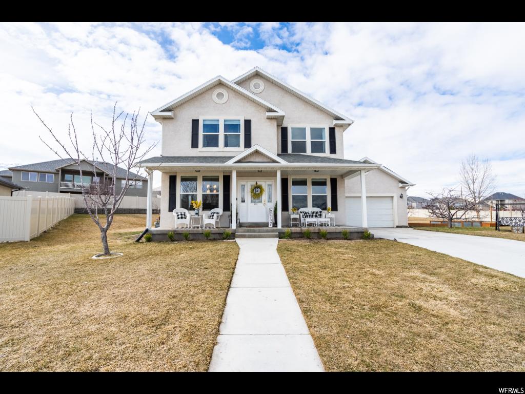 2227 S CHESTNUT CIR W Saratoga Springs, Utah GRAND OPEN HOUSE Saturday, March 16th, 1-3 pm. BE SURE TO CHECK OUT THE TOUR BUTTON AT TOP PAGE! Fall in love with this delightful 2 story, turn-key home on a wonderful cul-de-sac in a spectacular neighborhood! This 6 bed, 2.5 bath with a two-car garage is on 0.492 acres, giving you 4,082 sqft of spacious elegance to accommodate all of your hobbies and passions, and an expansive, partially-fenced yard for all of your outdoor needs. No detail was missed inside this home with new flooring throughout, remodeled bathrooms and a stunning modern, gourmet kitchen with quartz counter-tops. There are 2 furnaces, 2 water heaters and 2 AC units installed to ensure that your family never runs out of heat, hot water or air conditioning. Let the beautiful mountains and gorgeous view of Utah Lake draw you outside, where there's plenty of space for your family to relax and have fun together, including a 60' x 30' basketball court in your own backyard! Enjoy the mature fruit trees on the property and grow anything your heart desires in your own custom, garden boxes. Imagine cuddling up to a cozy fireplace with a good book to drift off to sleep and then wake up to a spectacular sunrise over the lake. All of this situated in a convenient, friendly neighborhood with outstanding schools, only minutes from Pioneer Crossing. Don't let this dream home slip through your fingers. Buyer to verify square footage.