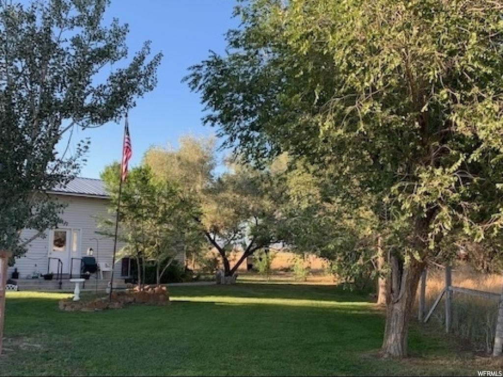 3840 13000 N E Chester, Utah Lovely 5 Bed 2 Bath on Fantastic Lot With 360 Views of the Valley Floor and Mountains. Tree Lined and Private with Space for Animals, a Huge Shop, Large Family Room and Kitchen. Buyer to confirm all.