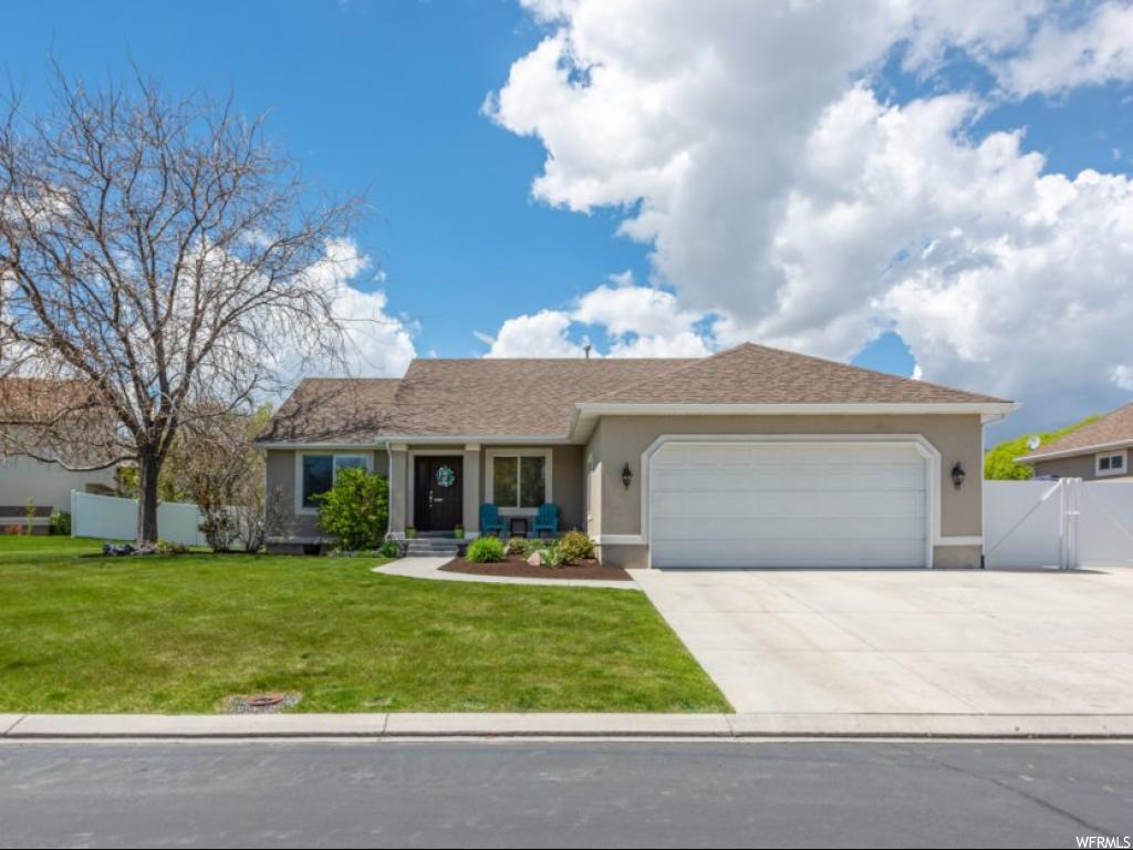 915 S TEAL RD E Saratoga Springs, Utah Multiple offers. You will love this home; like brand new and move-in ready; spotless! Beautiful wood flooring all throughout the main floor and wood laminate in master bedroom. Located within Saratoga's original planned development and within walking distance of one of the greatest swimming pools on the Wasatch Front; naturally heated and year-round! Plenty of room for a boat or RV on the massive RV pad; private boat launch within walking distance. Call me today for a personal tour of the home and all the amazing amenities.