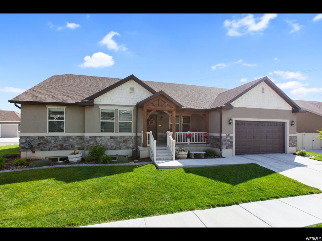 1518 S LAKE VIEW TERRACE RD Saratoga Springs, Utah Price Reduced - MUST SEE! Look no further for your perfect home. DOUBLE OVENS! Farmhouse sink, brick backsplash in kitchen, garden tub in master, granite countertops, mudroom, fireplace, shiplap wall, reclaimed wood paneling, wainscotting. Super cute home in a great neighborhood. Front room can be used as formal living room or as an office. Seller is in process of putting in vinyl fence in backyard. Short walk to community park with playground and basketball court. Great views of the lake. Hurry, this will not last! Square footage from recent appraisal. Buyer to verify all.