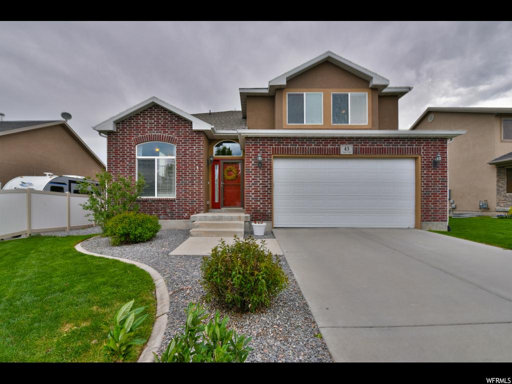 43 E ARGYLE WAY S Saratoga Springs, Utah NEW carpet throughout! This home has a great floor plan with a light bright and open entryway and formal living room with wood floors. Enjoy the family room with a cozy fireplace that is open to the dining room and kitchen, the kitchen has extra tall cabinets, solid surface counters, and stainless steel appliances. The backyard opens to a field for added privacy. Your family can grow into this home with tons of storage and an unfinished basement. Call to schedule a showing today! Info from Cnty records Buyer/Buyers agent to verify.