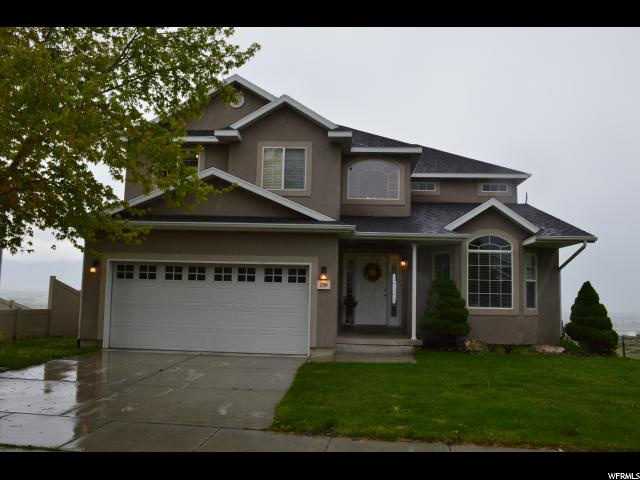 2396 ORCHARD WAY Saratoga Springs, Utah Have you seen the amazing view from the deck? You can see the entire valley and host on the huge deck. This home has new carpet, Grand living spaces, GRAND master suite with double sinks in the master, jetted tub and more. 100% finished basement with theater, game room, & large bedroom.