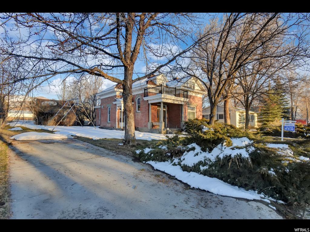 56 STATE ST N Fairview, Utah One of the most beautiful historic homes in Sanpete County is now available. The home has the original hand combed finish on woodwork and doors throughout. Original transom above each door still functions and has the original glass. Amazing original kitchen cabinets, door handles, clawfoot tub, lighting, and wallpaper. Three original stain glass windows are in perfect condition. The summer kitchen is separate from the home and has been restored into an additional bedroom, office, or playroom. This home has so much charm and has been loved for many years. Don't miss out on owning such a special property! *Home is being sold furnished
