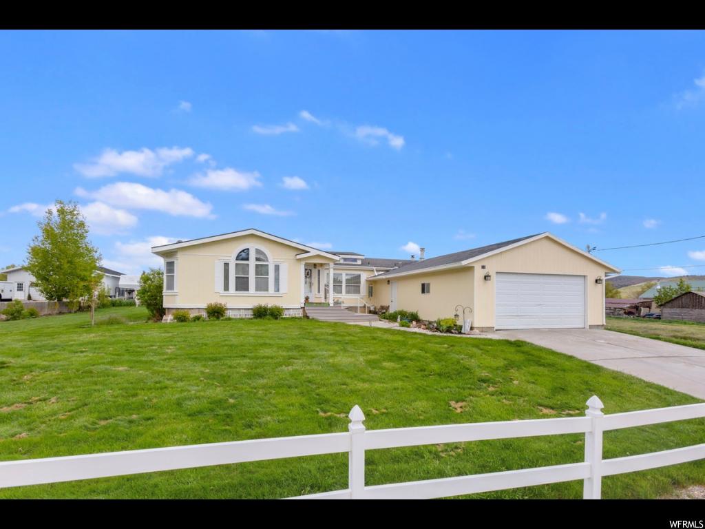 650 300 N W Fountain Green, Utah PRICE REDUCED. BACK ON THE MARKET. BUYER FELL THROUGH. HORSE PROPERTY WITH WATER SHARES. Great rambler with white picket fence located in Fountain Green. Lots of square footage in this home with room to grow in an unfinished basement. This home features a formal living room, formal dining room, and great room. The main floor is vaulted and numerous windows allow a lot of natural sunlight into the home. The home has a master bedroom with walk-in closet and vaulted ceilings. The master bath has French doors, a separate jetted tub and shower, and double vanity. Kitchen has oak cabinets, tile flooring, built-in microwave, gas range, island, and pantry. Built in china hutch. Half bath on main has sink and is plumbed for a toilet. Laundry room on main has a sink and both electric and gas hookups. Main floor has an additional full bathroom and two more bedrooms. Basement has a large cold storage room and is unfinished. Basement entrance access leads into garage. .96 acres with .5 water share included in the sale. Energy efficient LED lightbulbs throughout the house. Electric fireplace in family room excluded. Drapes excluded.