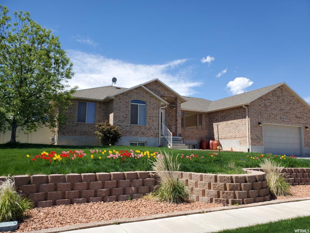 669 N BADGER LN Saratoga Springs, Utah Almost better than new! Priced to Sell, owner agent has recently installed granite countertops, new sinks and faucets. new dishwasher, range, paint and carpet and then put in a new HVAC system July 2019! 50 gal water heater and hardwood floor about 3 years ago. Mature trees, huge patio, RV Parking, sprinklers, mature landscaping, retaining wall, and a garden area, Basement is unfinished, waiting for your personal touch & has a walk out to the garage, NON HOA community! don't wait to see this one. WE INSTALLED PAVERS SO THEY ARE NOT LEVEL, NOT A SETTLING ISSUE.
