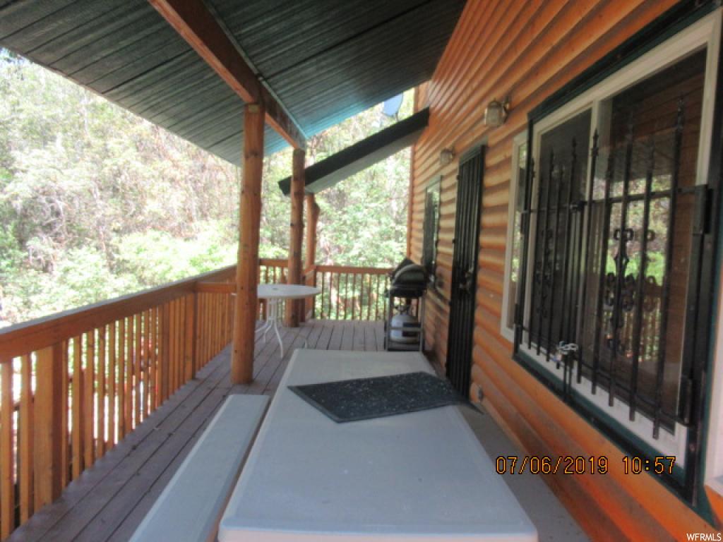 14690 BIRCH CREEK DR E D-47 Fairview, Utah Beautiful log sided cabin on Birch Creek. Year around stream with fish in it. Two lots for added space and privacy. Cabin has vaulted ceilings, pellet stove, Bedroom on the main floor with 2 bedrooms up. Family room up and down, 3 decks. Cabin comes fully furnished except for a few items listed in the agent remarks. Detached oversize 1 car garage. Washer and Dryer hookups in the garage. HOA includes a swimming pool, tennis courts, golf course, play ground etc. Excellent opportunity to own a cabin on the creek.
