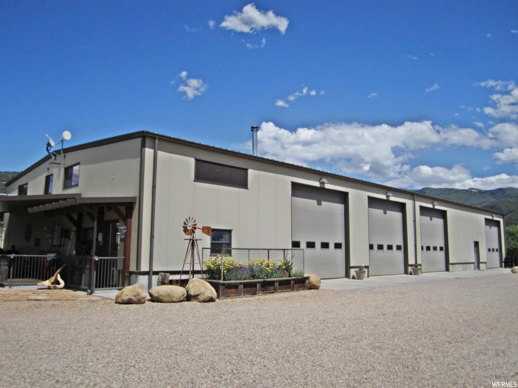 22320 12370 E N Fairview, Utah Spectacular home and shop on 1.84 acres in remote community outside Fairview and Mt. Pleasant. Perfect location for your dream home, with ample space for shop/garage use and storage. 2000 sq. ft of top of the line living space. Immaculate 60 x 120 shop/garage fully insulated, partitioned walls, and compressed air piping throughout. Propane heaters, wood stove, and wood pellet heat in shop/garage. Doors are 14 x 12, providing access for large trucks and trailers. Panoramic views with small stream flowing through the east side of property in spring and early summer. Granite countertops, wood stove in dining area. Alarm system with camera monitoring. Detached fuel storage shed with underground 600 gal unleaded tank and 600 gal diesel tank, including pumps. Large detached gun room, she-shed in yard, connex container, and large patio off living space with full length roller shading. Travel trailer/RV parking with fire pit and firewood shed. Backup generator that will support entire structure.