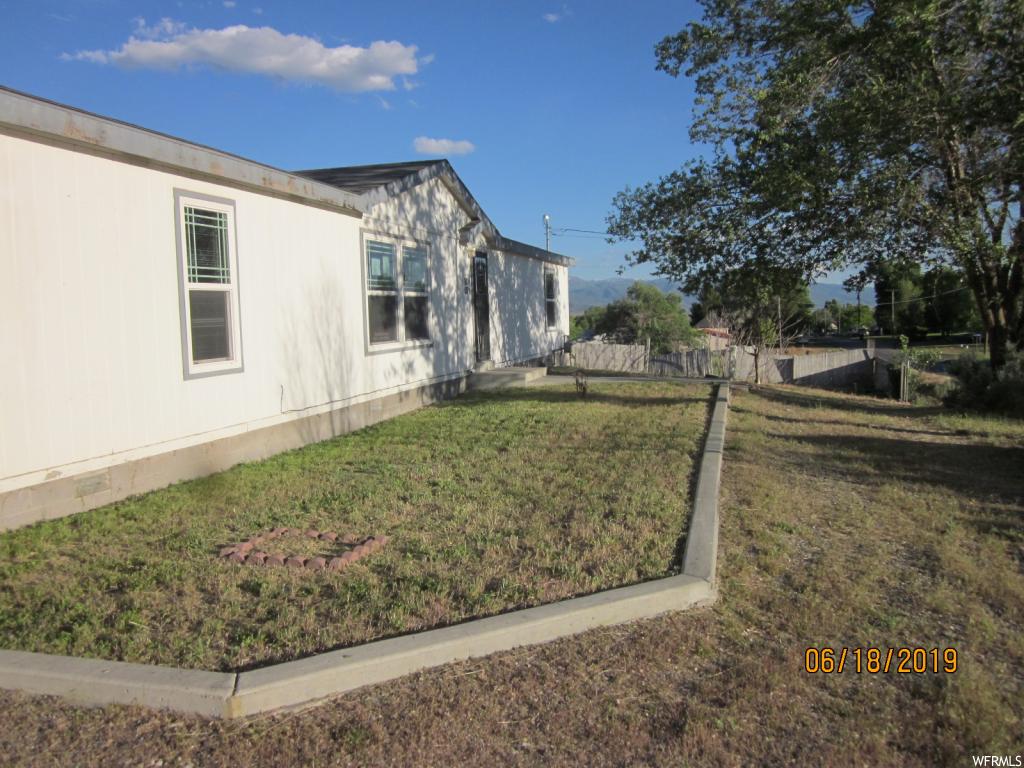 460 100 E N Moroni, Utah Here is Opportunity and Affordability! The lot is 1.07 acres, has several outbuildings, large patio with views, home is spacious featuring vaulted ceilings and a large master bedroom and bath with a walk-in closet. Square footage figures are provided as a courtesy estimate only and were obtained from Sanpete County . Buyer is advised to obtain an independent measurement. This property may qualify for Seller Financing (Vendee).