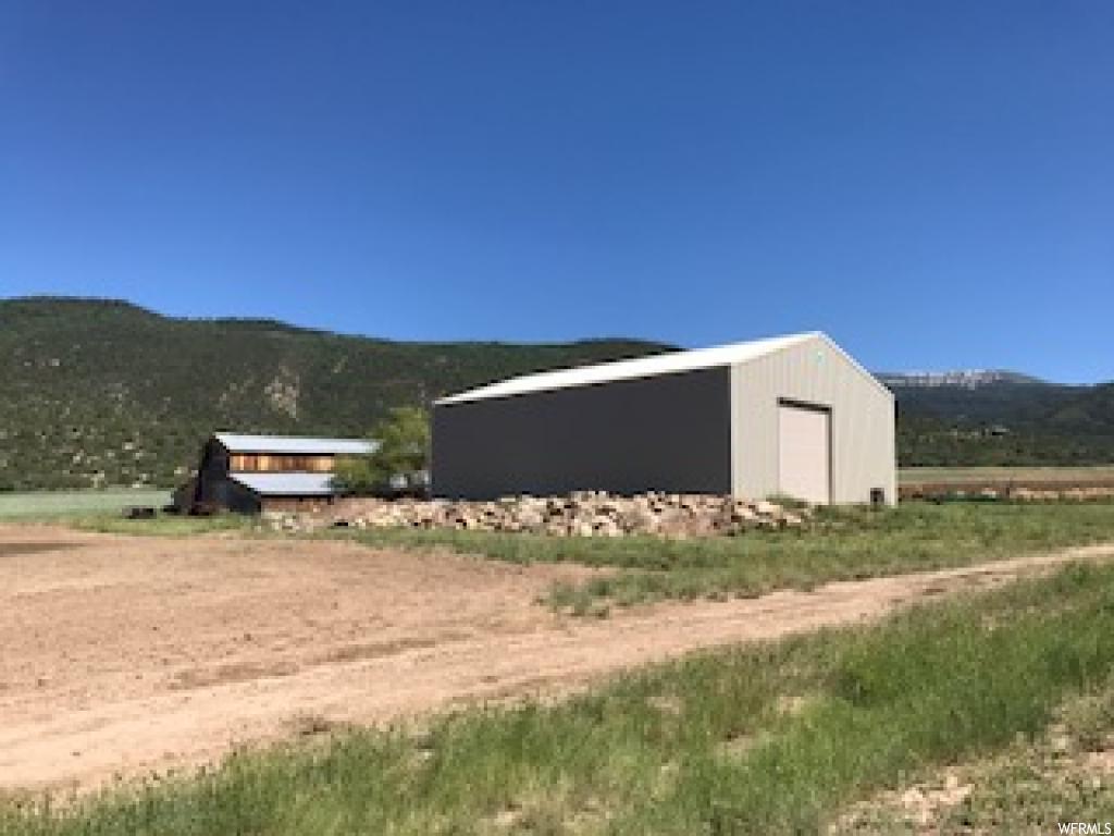 9641 10750 N E Spring City, Utah Beautiful setting at the foothills of Horseshoe Mountain, So East of Spring City on Canal Canyon Rd. Brand new Cleary barn ( 42'X64'X17'(height), with a concrete floor and 12'X14' (high) door. Also, a picturesque historic barn! Perfect for horses with Horseshoe Mt. trail for horses & hikers within 1/2 mile. 50 shares of Horseshoe pressurized irrigation water included. Call agent for more details.