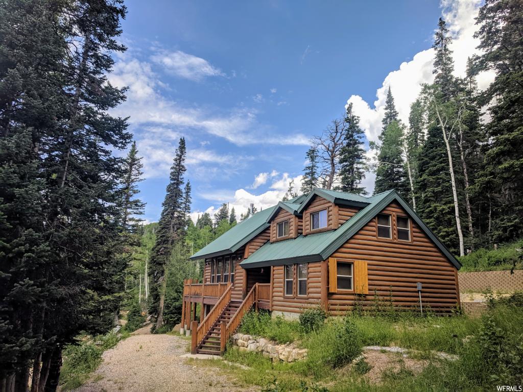 1 TUCKER FLATS Fairview, Utah Like NEW furnished log cabin, NO HOA on 20 acres of mostly useable land with pines, aspens bordering the National Forest just 7 miles north on Skyline Drive from the top of Fairview Canyon. Hundreds of miles of ATV trails right out the front door. Go 2 miles North East to the C canyon primitive area. Many lakes, streams all around you. Sunsets, clean crisp air, wildlife, SECLUSION, private and quiet. Gas is propane, water from the developed spring that never dries up, power from the propane generator, solar panels-new 2012 and batteries-new 2019. The 1,000-gallon propane tank is owned and was last filled about 6 years ago and is down to 50% after 2 or 3 weeks of usage each summer. Propane generator was new about 7 years ago. The 20ac is made up of two 10 acre lots. Features: Knotty pine cabinets; one piece Corian countertops; porcelain tile floor; triple sanded aspen tongue and groove on the walls and ceiling; stub for BBQ; solar/battery-powered lights at each outside door; propane water heater and large fridge; oversize Trex deck; two 1,000 gallon water storage tanks; text from cabin; cell service close by; a booster would most likely give you strong internet in every room; new LED lights 2018; 20x18 bunkhouse with lights & loft; wood shutters for outside the windows. Winter access is by snowmobile. Elevation 8,842 ft. MLS map is correct. Google Earth and Maps are 39.753707, -111.338985 Buyer to verify all information.