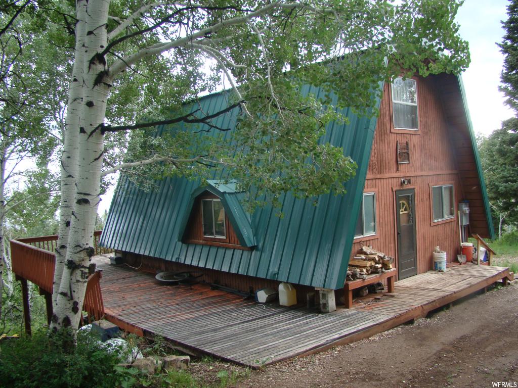 23540 DEER VALLEY DR N Fairview, Utah Cabin at the top of Skyline Mountain Resort. Beautiful view of the mountains & valley from the 655 square foot deck on the North East, and South sides of the cabin. One bedroom and bath on the main floor and 2 loft with one bedroom and additional living area. Tile and carpet flooring, granite, tile kitchen counter, Power connected, septic tank installed, water tank and pump, most furnishings included. 9'X19' basement room with gravel floor for storage. water well 560 feet away for easy water hauling.