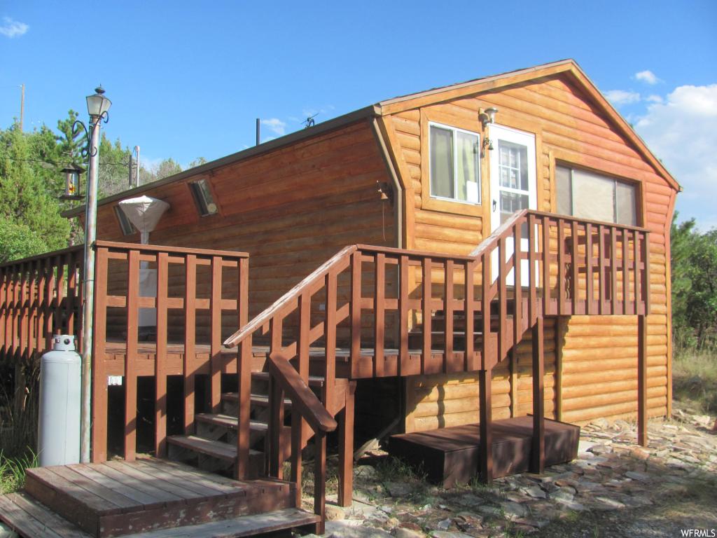 12450 CEDAR RIDGE RD E Fairview, Utah Rare opportunity for affordable cabin with year round access, power and water onsite. Large 1.91 acre lot gives you plenty of room to expand or just enjoy nature from your modest cabin and wrap around deck. Large detached garage for all your toys. Ready for your personal touch. Priced for a quick "as-is" sale. Map point is correct. Complete with community pool, tennis court, golf course of club house. Incredible getaway within a reasonable distance from the Wasatch Front.