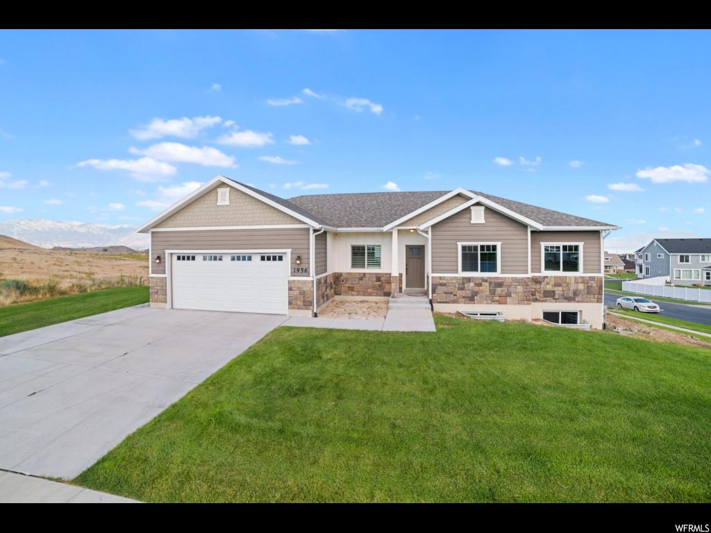 1956 S THOROUGHBRED DR Saratoga Springs, Utah Don't miss out on this gorgeous home with the best view in the valley! The kitchen is equipped with granite countertops and stainless steel appliances including a refrigerator and a new gas range. The home has great security features such as security cameras, and z-wave door lock and light switches. Other incredible features include: large covered Trex deck, 24'x24' garage, 9' ceilings, Nest thermostat, window shutters, water softener and Built Green energy certification. Outdoor heater to be excluded from sale. Square footage figures are provided as a courtesy estimate only. Buyer is advised to obtain an independent measurement.