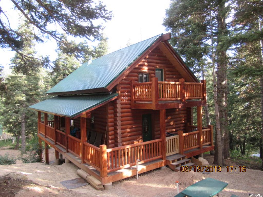 23075 DEER VALLEY DR N K-74 Fairview, Utah Beautiful Cabin nestled on a pine covered lot. Three decks take advantage of the surroundings! 10" swedish cope logs. Aspen tongue and groove ceiling. Cabin has been completed in the last 2 years and shows great!!! Wood burning stove. 10x20 garage for your snowmobiles or atv's. Sq.ft. as per county assessor. Buyer and Buyers agent to verify all information.