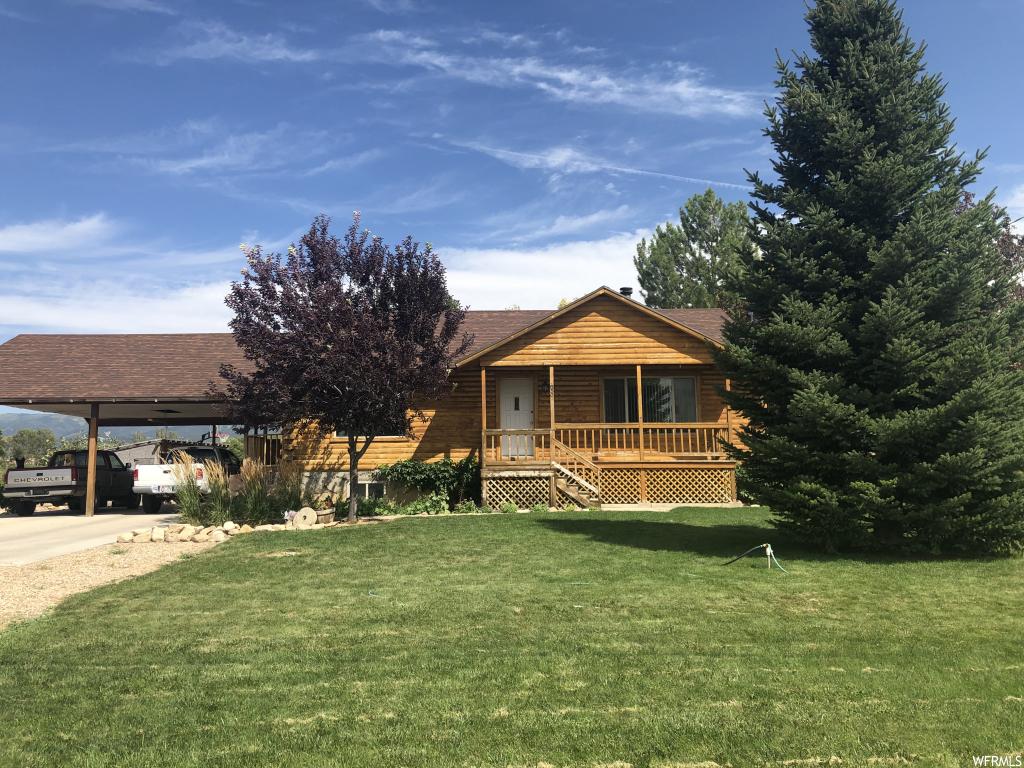 850 MAIN E N Spring City, Utah Don't pass this opportunity up!! Log cabin home on 1.06 acres. Bring the farm animals and live in a quiet location. Plenty of yard for all the extras. Two wood burning stoves with a walk out basement. Covered carport and sheds in back for all your yard tools, wood etc. Lots of mature trees surrounding the home. Large mudroom/laundry room right off the carport. Walkout kitchen to the back yard covered porch with a gorgeous view of the mountains. Square footage figures are provided as a courtesy estimate only and were obtained from Sanpete County. Buyer is advised to obtain an independent measurement.