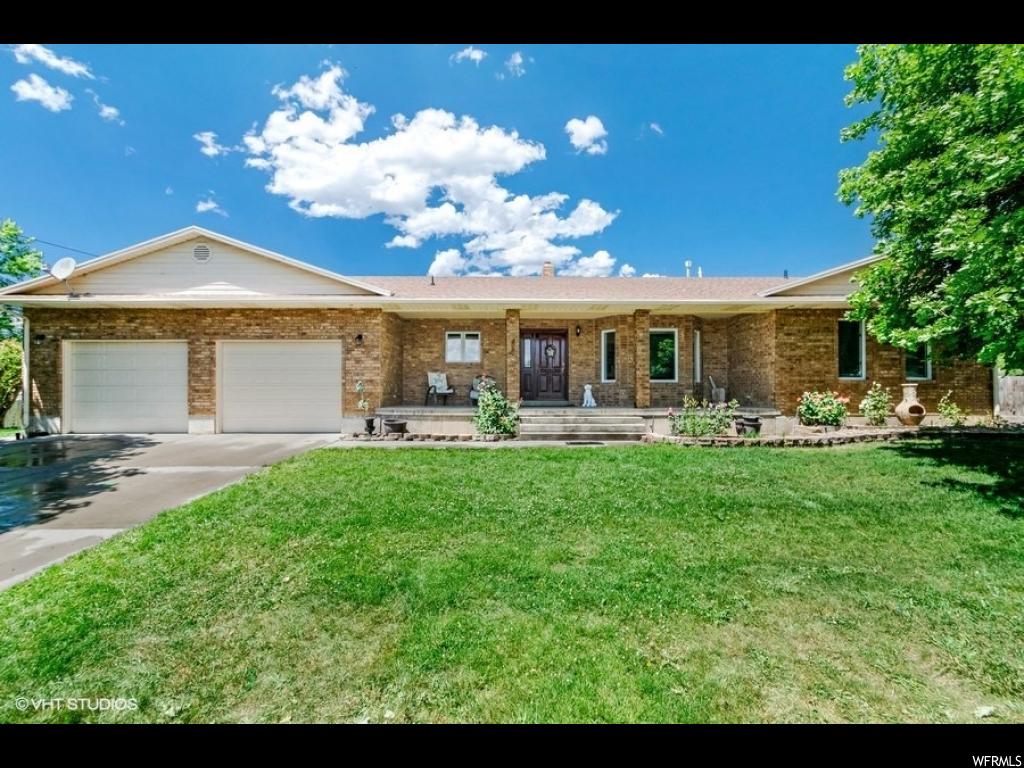 155 200 N E Fairview, Utah Beautiful custom Rambler on .37 acres in Fairview, UT. 3570 Sq ft, home is 100% finished. This house is in a very nice neighborhood. Close to schools, churches, parks, gas stations, restaurants, and the mountains. It has 6 bedrooms, upgraded bathroom counter top and faucet, and a laundry room upstairs and downstairs. There is also a hair salon, a HUGE garage, two covered patios, wood stove, separate basement entrance, shop/shed in backyard, sprinkler system, privacy slats in chain link fence, fully fenced backyard, 4 mature apple trees, 3 pear trees, mature maple trees around the property, low maintenance yard, RV parking and much more. Very well kept home.