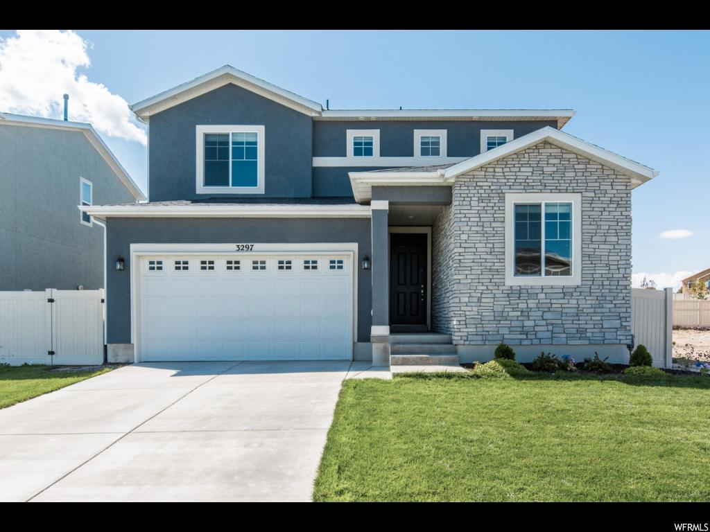 3297 S HAWK DR Saratoga Springs, Utah Spacious and accommodating, this 2-story home features an open-concept main floor with 3 charming bedrooms upstairs and a 4th bedroom on the main with a 3/4 bath w/shower, which can be converted to a study or music room. The Greatroom flows into an inviting bright kitchen with a granite island & adjacent dining room with amazing large windows/sliding doors that opens to a cozy covered patio. Upstairs is a sprawling master suite, including an attached bath and walk-in closet. It includes a DSC security system & a sublime Sonos audio system with Klipsch speakers in ceiling & patio. The home also comes with a water softener, a large/tall crawl space for storage (800 sqft), and a fully fenced backyard. Within walking distance to the Elementary.