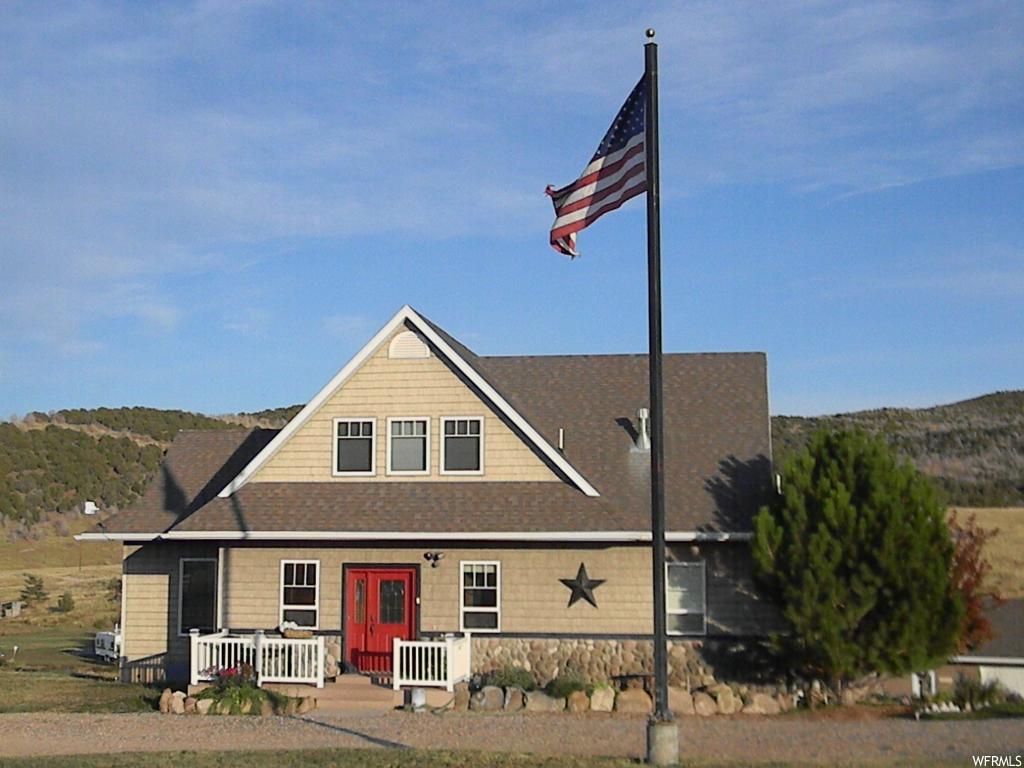 6530 31220 N E 8 Fairview, Utah (A2187CM) Priced to sell! Over the top quality construction in this house. Beautiful inside and out. Lots of kitchen cupboards made out of quarter cut oak. Counter-tops are soap stone from South America. Kitchen has double oven, 6 burner gas top with warming oven. Central vac. No maintenance exterior. Fenced garden. Wonderful views from every window. Large deck. Huge garage/shop. Mother-in-law apartment is fully furnished. Flag pole, circular drive. Square footage to be verified by Buyer.