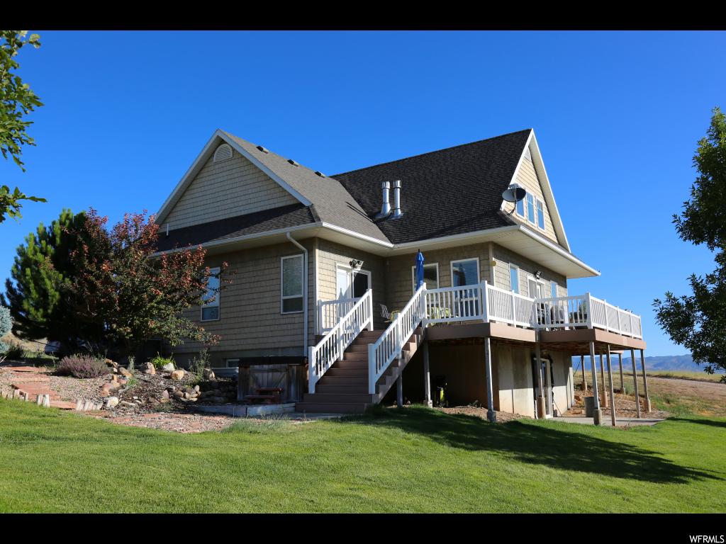 6530 31220 N E 8 Fairview, Utah (A2187CM) Priced to sell! Over the top quality construction in this house. Beautiful inside and out. Lots of kitchen cupboards made out of quarter cut oak. Counter-tops are soap stone from South America. Kitchen has double oven, 6 burner gas top with warming oven. Central vac. No maintenance exterior. Fenced garden. Wonderful views from every window. Large deck. Huge garage/shop. Mother-in-law apartment is fully furnished. Flag pole, circular drive. Square footage to be verified by Buyer.