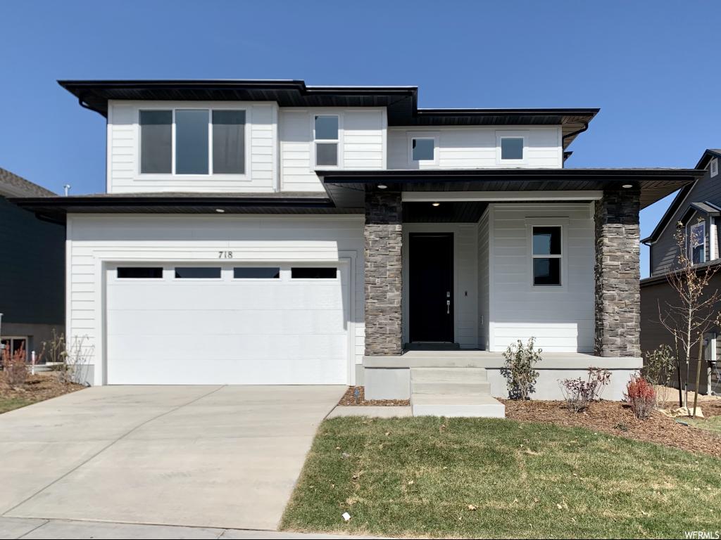 718 W HYDRANGEA WAY N Saratoga Springs, Utah Wild Rose - 127 - Jackson. Ready for move-in! This beautiful Jackson home design features an exterior contemporary elevation, 3 bedrooms, 2.5 bathrooms, and a multipurpose tech space. The main floor includes an open-concept great room, and kitchen with stainless steel appliances including the fridge, linen quartz countertops, and upgraded white craftsman style cabinets. The second floor offers three bedrooms, full bathroom with quartz countertops, and grand master suite with double vanity and walk-in closet. Back fencing included! This home includes smart features such as: Echo Dot, Schlage Smart Lock, Honeywell Lyric Thermostat, Ring Video Doorbell, and LiftMaster Garage Door Opener with MyQ Technology. Other Lennar "Everything's Included" home designs, elevations and color combinations are available! Wild Rose is now open with two "everything's included" model homes.