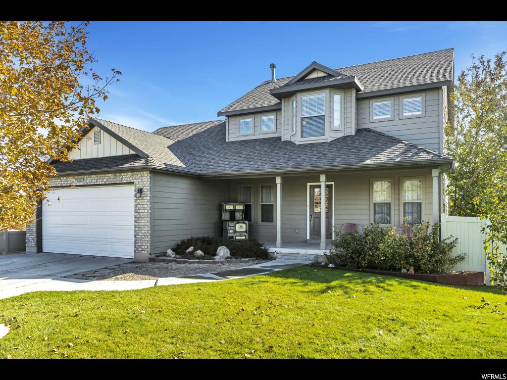 1873 N CONCORD PL W Saratoga Springs, Utah Multiple offers received! Pride of ownership in Saratoga Springs! Original owner and beautifully maintained. This 2 story, 7 bedroom, 3 bath home in Harvest Hills is a MOVE-IN ready home. A GREEN THUMBs dream of a garden and back yard or relax on the front porch mornings and/or evenings. Inside boasts an open floor plan, large kitchen and great room with engineered hardwood floors. One bedroom or office on the main level. Large master suite upstairs with large walk-in closet. The basement has been finished nicely with 3 large bedrooms and lots of storage.