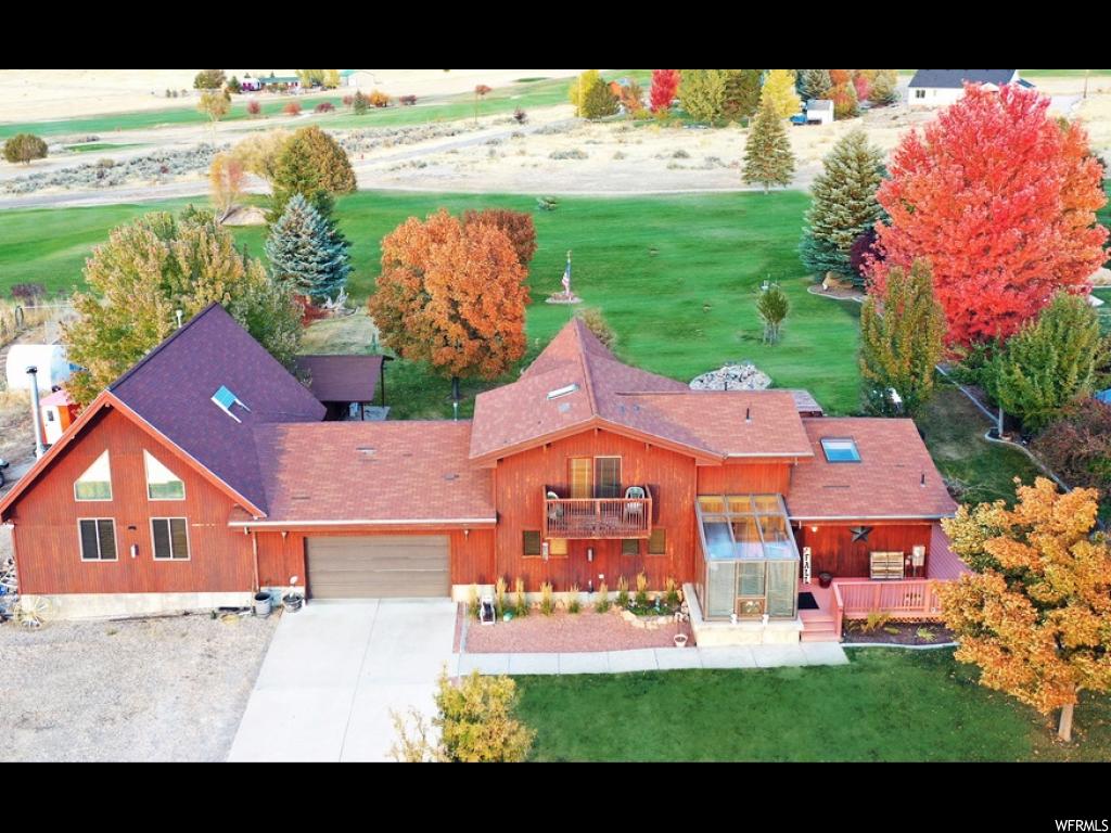 2205 SKYLINE MTN Fairview, Utah Incredible views from golfers dream home located on the 2nd fairway at Skyline Mountain Golf Resort! This beautiful home is located in Sanpete County's only gated golf community and hosts a separate 2 bedroom mother-in-law apartment with an incredible bonus great room that has soaring vaulted ceilings a cozy fireplace and its own 2nd kitchen for hosting extra events or large gatherings! The property's amazing landscaped yard includes a waterfall/pond, golf cart garage and greenhouse! Some furnishings included with the sale of the property.