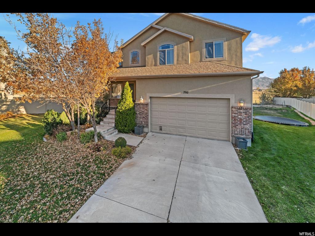 792 N CANTERBURY CT Saratoga Springs, Utah Beautiful recently updated 5 bedroom home conveniently located in a quiet subdivision just off Redwood Road and Pioneer Crossing, across from grocery store shopping. Only 5-10 minutes from I-15. Large open kitchen/living area. Finished basement with a spacious yard. Wood flooring throughout the the main level. Many large windows for beautiful natural light. Master bedroom features a large closet with substantial shelving. Master bathroom includes windows, double vanity sink, and jacuzzi. Square footage figures are provided as a courtesy estimate only. Buyer is advised to obtain an independent measurement.