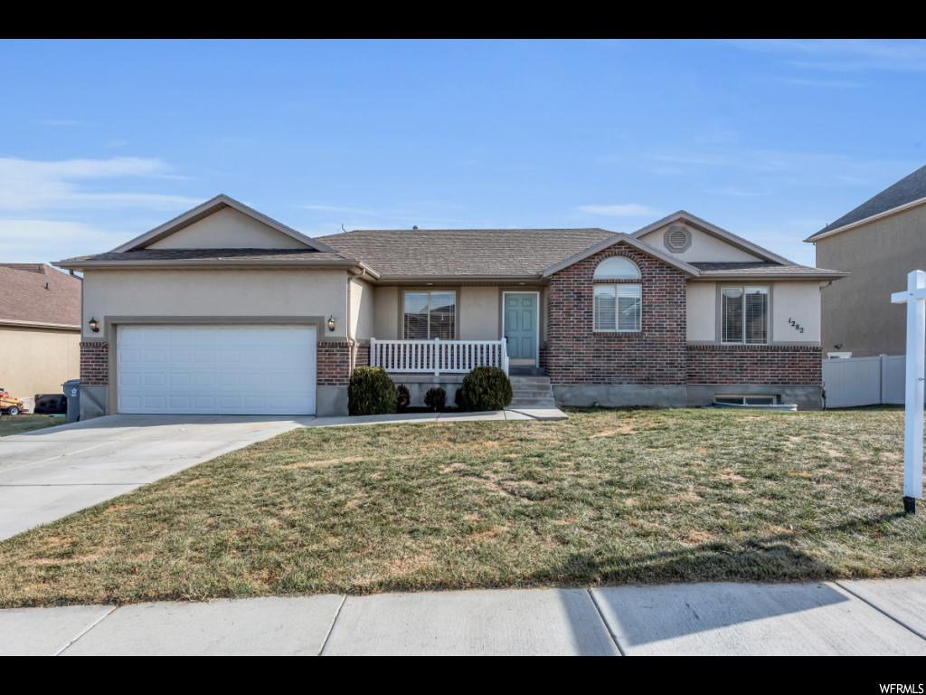 1282 S MEADOW RUN Saratoga Springs, Utah Newly updated and ready to go. All Matching Kitchen-aid High-end Stainless steel appliances, granite counter-tops with white cabinets. Vaulted ceilings, paint and carpet. Master bathroom has separate shower and large soaker tub. Huge backyard, fully landscaped. Large laundry room off the kitchen front load washer dryer stay! Refrigerator stays as well! Unfinished daylight basement with extra tall ceilings. Easy to show anytime. West Facing so you can enjoy the great views of the lake and mountains and the sun melts the snow off the driveway. NO HOA dues or fees which means you can buy more house without worrying about increasing HOA dues every year.