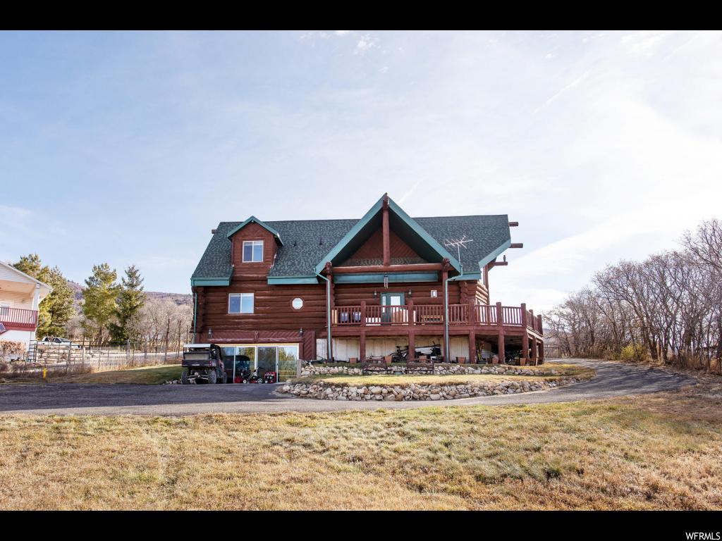 24625 11875 E N Fairview, Utah Clean custom log home nestled on 1.15 acres in quiet Fairview, Utah...situated on the east bench and offering amazing views! This wonderful opportunity is accessible year round allowing it to be your full time residence or a second home, and providing you with those needed summer getaways or a peaceful/cozy winter retreat! The quality wood interior also offers vaulted ceilings, massive windows for natural light, stone fireplace, main floor master suite, 2 family rooms, and an upstairs loft area for an office and the family sleepovers. The walkout basement has loads of storage and a negotiable swim spa and hot tub, enclosed in a glass sliding door. If you are looking for a place to get out of the city, traffic and smog...this is the home for you!