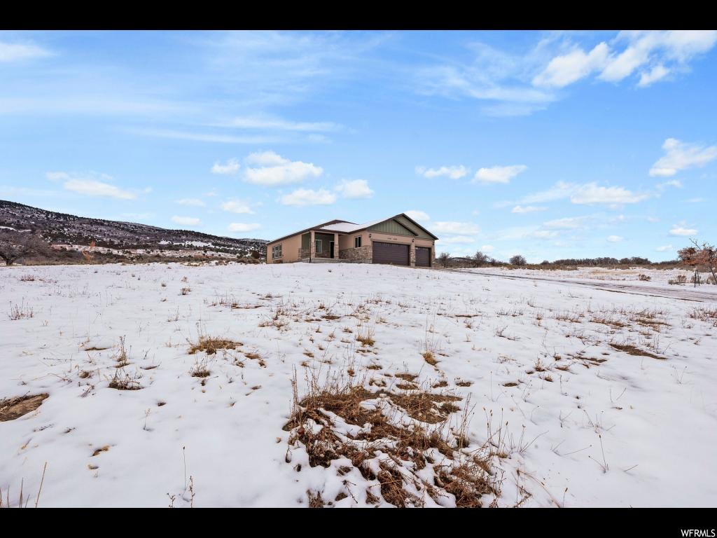 23185 12060 E N Fairview, Utah Beautiful home sitting on 1.49 acres with an amazing view overlooking Fairview. Within a 45 minute drive of Spanish Fork. This home has a fully finished basement which includes a large living room and theater room for the family to enjoy. It also includes a stunning kitchen with two-tone cabinetry and lots of counter and storage space. Upgrades throughout the entire home including soft water, tankless water heater, granite, and wood-look tile. Oversized 3 car garage with lots of storage. Square footage figures are provided as a courtesy estimate only. Buyer is advised to obtain an independent measurement.