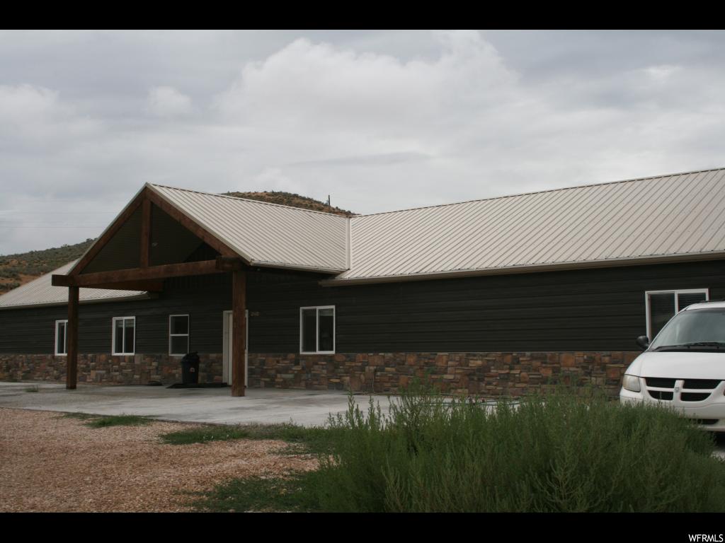 2830 19500 N E Moroni, Utah This home was built and has been used for a residential therapy treatment facility. It is set up as a home environment with a large kitchen, family area. Home is heated with a boiler system (installed about 1 year ago). The 3,900 sq. ft. workshop/garage is heated, has power, and a half bath. This huge workshop/garage makes for a potential business opportunity. Buyer and buyer's agent to verify all information.