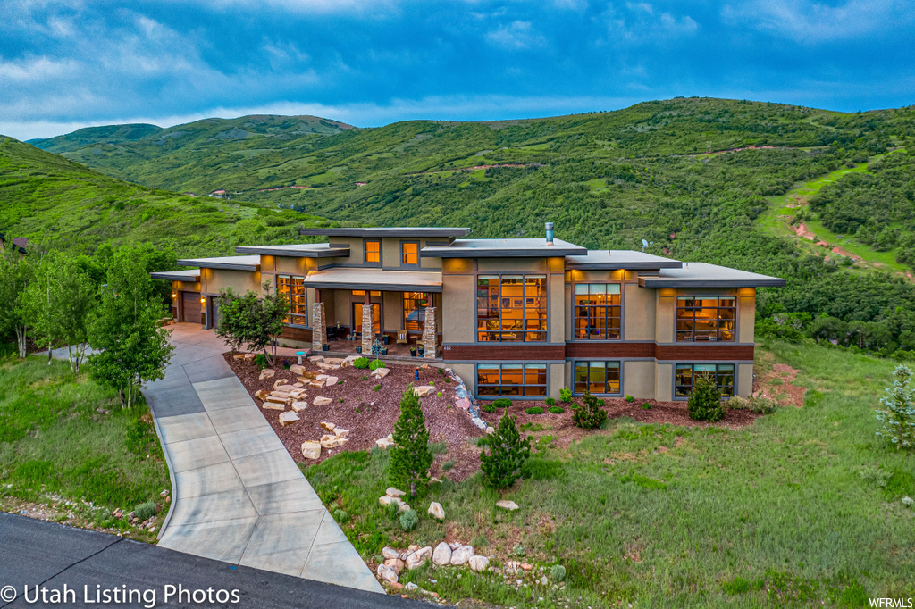 492 N MARATHON CIR E Salt Lake City, Utah https://www.youtube.com/watch?v=B7ujF-84jnU Unlike other mountain homes where there is only a single view, this designer home is architected for two-direction vistas provided by its uniquely situated parcel. Taking advantage of this, each room has windows 4-to-6 times larger than average. Its concrete 17" wall construction makes the home extremely efficient resulting in energy savings of up to 75%. The home is appointed via a philosophy of elegance and warmth. There is no need to list upgrades. They are all there. The knowledgeable and discerning buyer will instantly comprehend as they transit from room-to-room taking in the views and the finishes. While it may reside in the mountains, it is only ~30 minutes to the airport or to skiing. Square footage figures are provided as a courtesy estimate only and were obtained from county records. Buyer is advised to obtain an independent measurement.