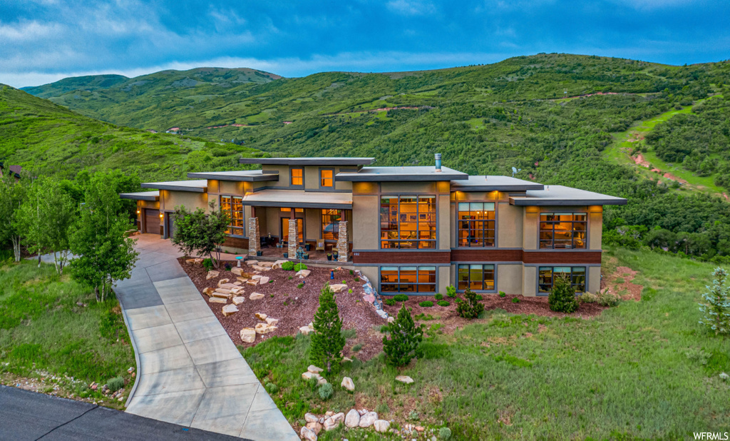 492 N MARATHON CIR Salt Lake City, Utah This $2.4M cost-to-build luxury home sits atop one of the most panoramic lots in the Wasatch Mountains. Perched half-way between SLC and Park City, skiing and downtown are close by. It's design, organized to optimize the spectacular views to the east and west, is comprised of concrete walls and white roofing making this home extremely energy efficient (~4x standard construction). Steel staircases, solid wood doors, stamped concrete patios, whole home audio, sauna and professional kitchen appliances are but a few of the luxury appointments. Extensive network of hiking trails are less than 1/2 mile away
