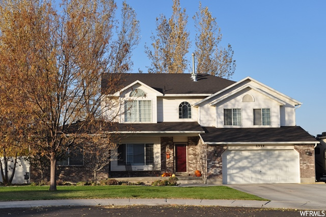 3334 W 12180 S Riverton, Utah OPEN HOUSE 11/21 1-4pm. RARE HALF ACRE LOT, (zoned equestrian,) situated in a cul-de-sac, w/an amazing home featuring a grand living room for large family gatherings, plus a casual living room w/fireplace, and a third, spacious room in basement. Vaulted entrance, grand room, and master. Open floor plan w/remodeled kitchen including an island, granite counters, and undermount lighting. Appliances include a new convection oven & dishwasher. This is a single owner property which has been well cared for & loved. Entire home just professionally painted. Remodeled 5 piece master bath and Toto toilets in all bathrooms. New carpet in basement which also offers deep cold storage and ample closet space. The list goes on w/RV parking, fruit trees, and huge, private yard for hosting w/firepit, built-in basketball court, holes for Volleyball net, and patio pavers sent in for holding a trampoline. Cover was added to the back patio, under which the Hot Tub sits and is included! Fully fenced w/private, 6' vinyl fencing. Yard has two garden sections and back of lot is fenced off, w/many possible uses such as a dog run. Shed allows f/extra storage / workshop, & workbench stays. New roof in 2018. Two, newer AC units and two, newer 40 gallon h2Oheaters. Water share & secondary water. Square footage figures are provided as a courtesy estimate only and were obtained from tax data . Buyer is advised to obtain an independent measurement.