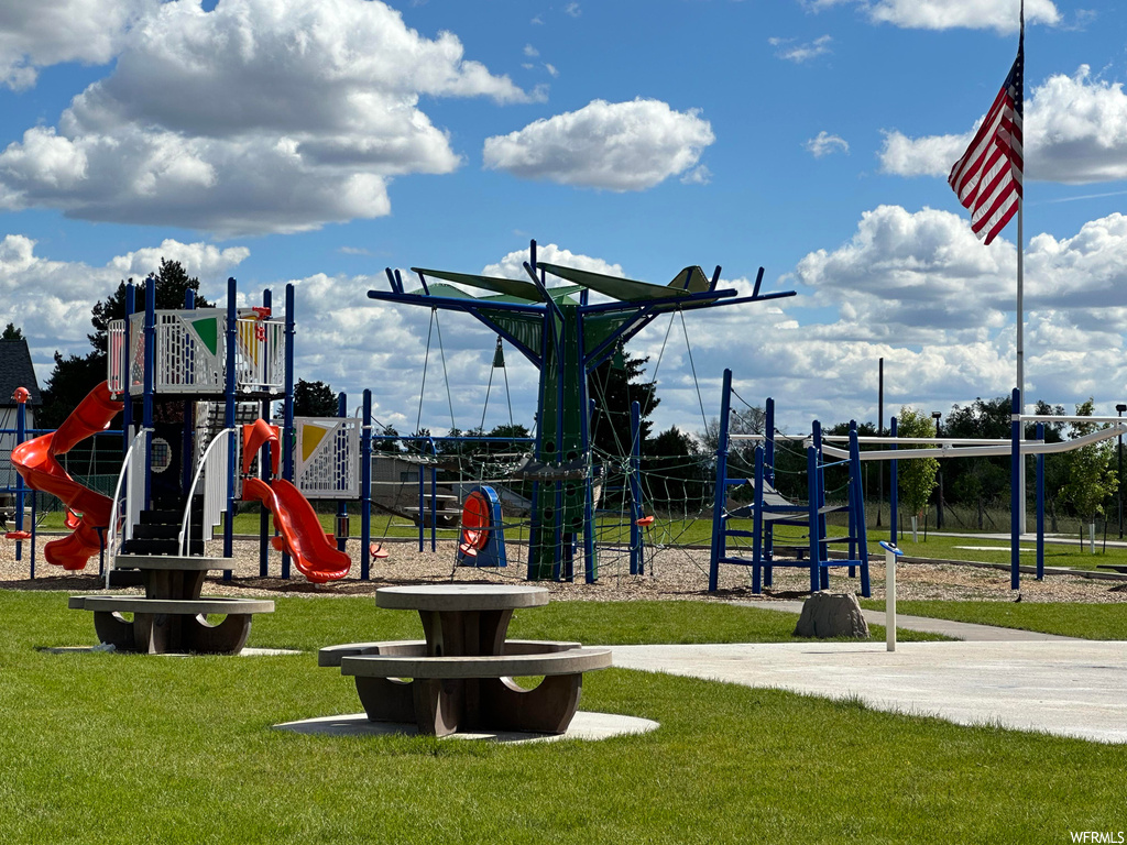 View of jungle gym with a yard