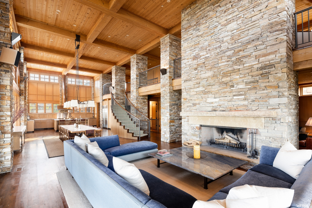 hardwood floored living room featuring a fireplace